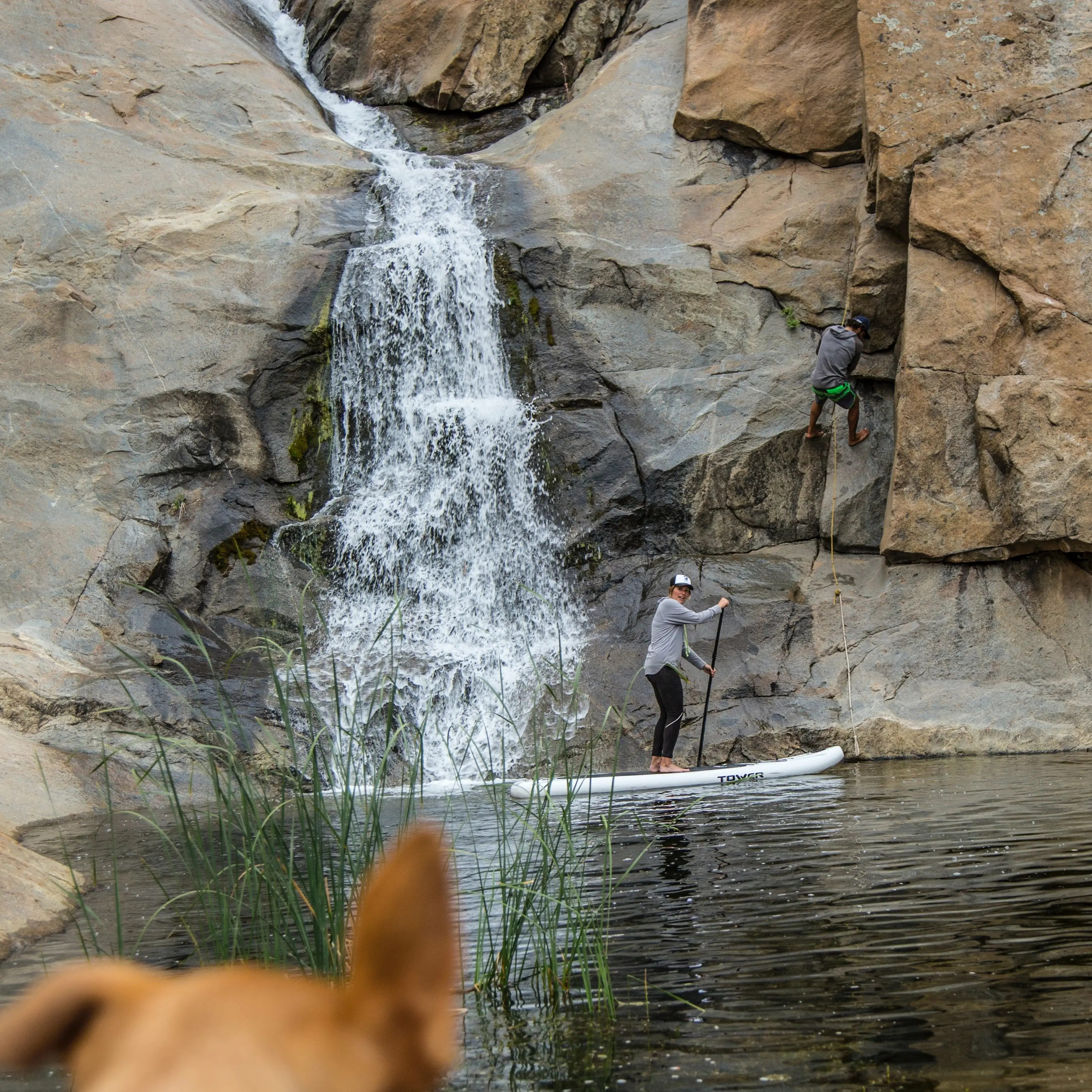 paddling under a waterfall